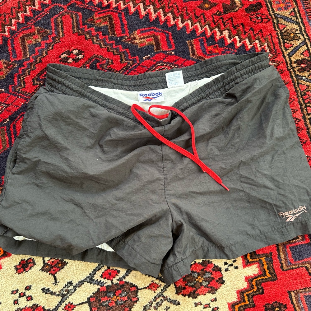 Reebok Faded Black Shorts with Bright Red Accent